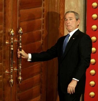 Bush confounded by complex physics of locked door.